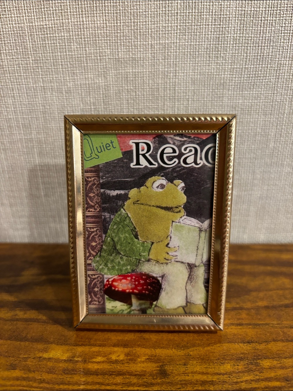 Tiny gold coloured metal frame
